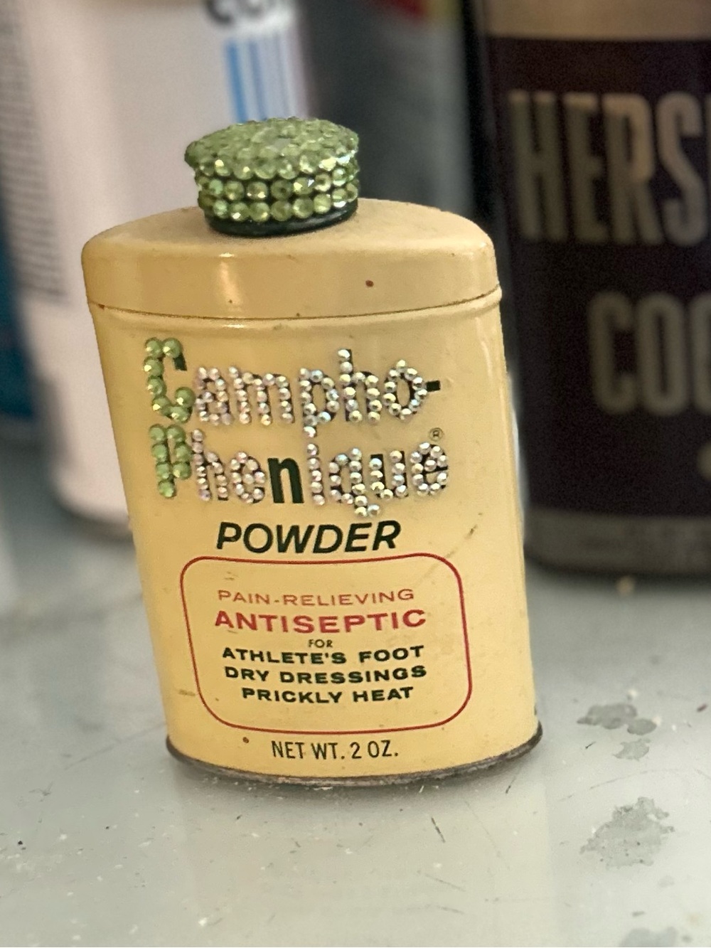 Vintage Collectibles Mixed Lot: Campho-Phenique Powder, Hershey’s Cocoa Tin, and